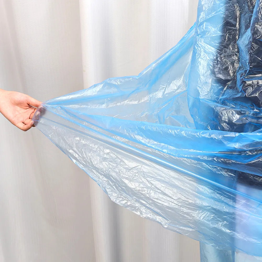 Lightweight waterproof disposable rain coat in vibrant color, ideal for outdoor protection from rain by Budget Mart.