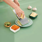 Multifunctional vegetable slicer by Budget Mart with various blade attachments and a compact design for easy storage.