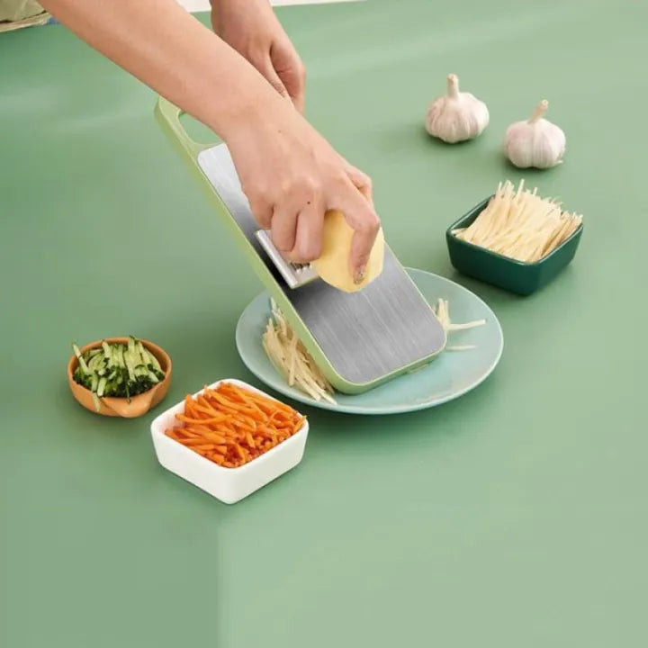 Multifunctional vegetable slicer by Budget Mart with various blade attachments and a compact design for easy storage.